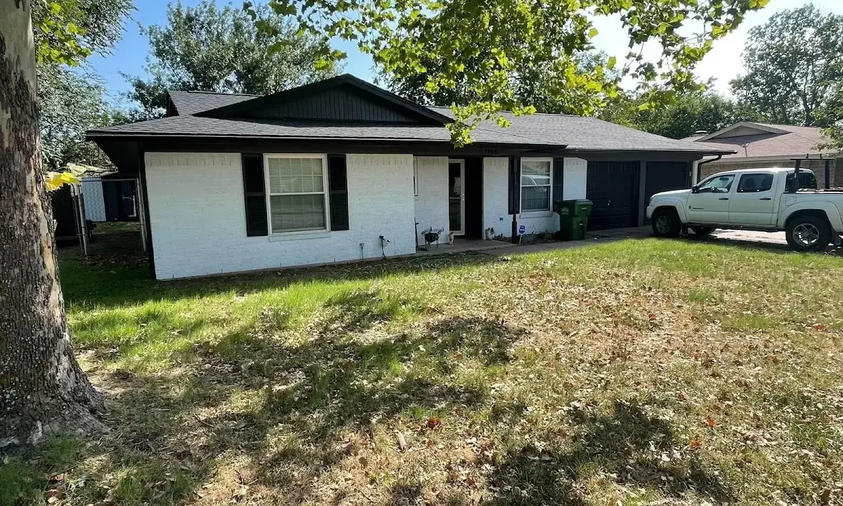 Professional roofing crew working on a residential roof in Andover